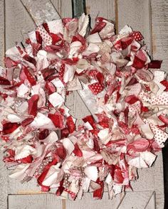 a red and white rag wreath on a door