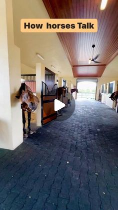 a horse is standing in the middle of a hallway with its mouth open and it's tongue out