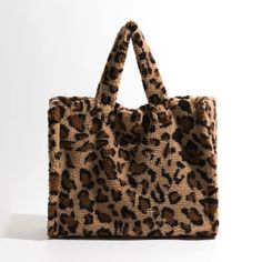 Unleash Your Style with Our Leopard Print Tote Step into the world of fashion with our stunning Faux Fur Tote Bag, a must-have accessory that combines style and versatility. Perfect for the fashion-forward woman, this bag is your ideal companion for any occasion, whether you're shopping, meeting friends, or just out for a casual stroll. Exceptional Design and Quality Crafted from high-quality faux fur, our tote bag boasts a bold leopard pattern that makes a statement. The bag's spacious interior Fur Tote Bag, Leopard Print Tote, Faux Fur Material, Meeting Friends, Meet Friends, Casual Tote, Shopper Tote, Leopard Pattern, Print Tote