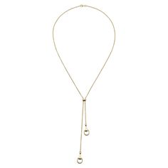 Gucci marks the 20th anniversary of its iconic Horsebit jewelry line with timeless and iconic pieces crafted from 18k yellow gold. This chain necklace, measuring 22.6 inches in length, showcases two pendant details inspired by the half-horsebit motif. Gucci Ladies Necklaces. SKU: YBB795850001. Color: Yellow. Metal Type: Yellow Gold. Metal Stamp: 18k. Gem stone type: None. Necklace style: 1 Band. Gucci White Gold Jewelry For Anniversary, Classic Gold-tone Long Necklace, Formal Gold Chain Necklace With Round Pendant, Luxury Lariat Jewelry With Cable Chain, Classic Yellow Gold Jewelry With Clavicle Chain, Luxury Lariat Cable Chain Jewelry, Elegant Gold-tone Jewelry With Cable Chain, Luxury Long Necklace With Cable Chain, Classic Yellow Gold Long Necklace