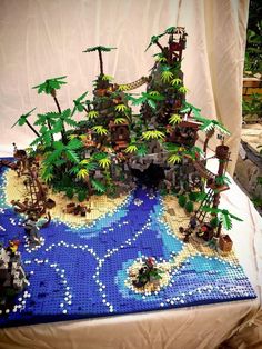 a table topped with lots of legos and trees