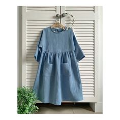 "Muslin 100% cotton dress with a loose fit. 3/4 sleeve. Two pockets on the front for children's treasures. A coconut button fastening at the back. Avalible sizes (child height ): US 3 (approx. height 38\"/96cm) US 4 (approx. height 41\"/104cm) US 5 (approx. height 44\"/112cm) US 6 (approx. height 47\"120cm) US 7 (approx. height 50\"/127cm) US 8 (approx. height 52\"/132cm) The item is made to order and it takes about 5-6 days to go and will be shipped immediately when it will be ready. I will inf Cotton Half Sleeve Dress With Pockets, Long Sleeve Cotton Dresses With Pockets, Blue Cotton Dress With Pockets, Light Blue Long Sleeve Cotton Dress, Casual Half-sleeve Dresses With Pockets, Daywear Cotton Dress With 3/4 Sleeves, Cotton Daywear Dress With 3/4 Sleeve, Cotton Dress With 3/4 Sleeves For Daywear, Light Blue Long Sleeve Dress With Pockets