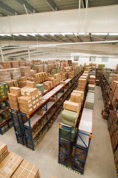 a warehouse filled with lots of boxes and pallets