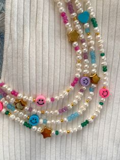 A beautiful natural pearl necklace with jade stones and happy face, heart and star beads, handmade 🤚 🤩✨ with a measurement of 14 inches and a beautiful 2-inch extender. ✨Fun necklace, for all ages, perfect for summer This and jade necklace is handmade ✋🏽 and I am always selecting pearls 👀 the best pieces for my creations, also the material is 100% stainless steel. We think a lot about each of our creations so that it is not a simple piece but a detail with a lot of meaning. ✨ What does your Preppy Necklaces, Smiley Face Necklace, Colorful Choker, Necklace Y2k, Natural Pearl Necklace, Y2k Necklace, Pearl Beaded Necklace, Handmade Jewlery, Face Necklace