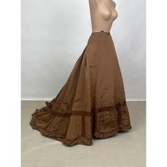 Antique 1860s Victorian Brown Silk Full Length Skirt With Bows and Train AS IS. No details were spared on this authentic 1860s full length voluminous skirt. It is made from a stiff brown silk with a slight sheen. The front of the skirt is straight while the back is pleated into the waistband for added volume. The bottom 12 inches of the skirt are decorating with dark brown ribbon and bows. The hemline features a ruffled scolloped trim of fabric. The skirt has a dramatic train. There is a left side seam opening with two hooks & eyes for closure. Only the bottom 17 inches of the skirt are lined with a coated cotton. There are ribbons sewn on the interior of the skirt to  hold the cage crinoline in place. There is a pocket on the right side seam. This piece is in very good condition consideri Vintage Full Skirt Petticoat For Costume, Victorian Petticoat For Costume, Vintage Petticoat With Ruffled Skirt For Costume, Vintage Voluminous Full Skirt Petticoat, Vintage Full Skirt For Costume, Vintage Full Voluminous Petticoat, Victorian Skirt With Ruffles, Vintage Long Ruffled Petticoat, Vintage Costume Gathered Skirt