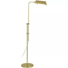 a floor lamp that is on top of a white surface and has a metal base