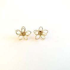 Small metal flower wire stud earrings. Unique earrings for a unique person. Not intended for children ages 13 and under. Also, for many items we can accommodate large orders, so please send us a message. Metal Flower Charm Earrings, Gold Wire Wrapped Flower Earrings Gift, Adjustable Wire Wrapped Flower Earrings, Adjustable Nickel-free Flower Earrings, Adjustable Metal Flower Earrings, Adjustable Gold Flower Earrings, Handmade Flower Gold Earrings For Gift, Nickel-free Flower Shaped Metal Earrings, Nickel-free Metal Flower Earrings