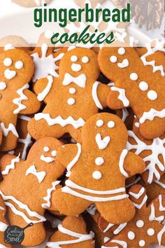 a plate full of gingerbread cookies with white icing