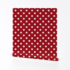 a red and white polka dot paper with white dots on it