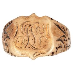 Lovely antique Victorian shield signet ring (circa 1880s to 1900s), crafted in 14 karat rose gold. From what we can decipher, the center shield is engraved with the initials "SL". The side shoulders feature a pretty scrolling design that terminates to the shield mount. The saddle of the ring is low and curves to the shape of the finger. The ring is in good condition with patina and wear evident. We have not cleaned the ring in order to preserve the patina and collector value. Particulars: Weight Vintage Fine Jewelry, Gold Signet Ring, The Shield, Rich Girl, Antique Victorian, Signet Ring, Art Vintage, Antique Gold, Cover Design