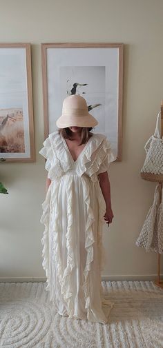 This handmade Bohemian dress is crafted from 100% organic cotton. Its flowing silhouette and tiered layers embody a free-spirited charm, making it a perfect choice for warm days while promoting sustainable craftsmanship. White Bohemian Dress, White Bohemian, Boho Chic Dress, Dress Bohemian, Bohemian Wedding Dress, Charm Making, Dress Boho, Free Spirited, Bohemian Wedding