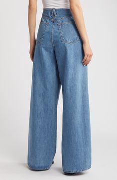 Tucked pleats structure the raw, cutoff waistband of these full-length, wide-leg jeans crafted from nonstretch organic-cotton denim in a light-blue wash. 33 1/2" inseam; 25" leg opening; 13 1/2" front rise; 16" back rise (size 29) Zip fly with hook-and-bar closure Five-pocket style 100% organic cotton Machine wash, tumble dry Made in the USA of imported fabric Modern Light Wash Flare Jeans For Spring, Light Indigo Wide Leg Jeans, Modern Light Wash Spring Flare Jeans, Wide Leg Rigid Denim Bottoms For Spring, Spring Wide Leg Rigid Denim Flare Jeans, Spring Wide Leg Rigid Denim Bottoms, Spring Full Length Flare Jeans In Rigid Denim, Spring Full Length Rigid Denim Flare Jeans, Spring Full-length Rigid Denim Flare Jeans