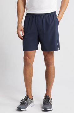 Keep your valuables protected while running errands or around the track in these elastic-waist shorts made from a lightweight, stretch-enhanced fabric. A secure hidden-zip pocket is perfect for stashing a key or other important essentials. 7" inseam; 22 1/2" leg opening; 11 1/2" front rise; 15 1/2" back rise (size Medium) Elastic waist Front slant pockets; hidden side-zip pocket Reflective logo enhances visibility in low light or at night 89% polyester, 11% spandex Machine wash, tumble dry Impor Summer Athletic Shorts With Functional Pockets For Sports, Sporty Summer Activewear With Functional Pockets, Functional Athletic Shorts With Go-dry And Short Inseam, Functional Pocket Shorts For Summer Workouts, Summer Workout Shorts With Functional Pockets, Nylon Athletic Shorts With Side Pockets For Running, Athletic Shorts With Functional Pockets For Sports, Athleisure Nylon Shorts With Comfort Waistband, Nylon Athleisure Shorts With Comfort Waistband