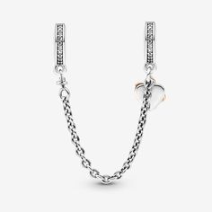 Keep a reminder of the importance of family with the Family Heart Safety Chain. This safety chain is hand-finished in sterling silver and a 14k rose gold-plated unique metal blend. It features two dangling hearts, one warm-toned open heart with an infinity sign and a second heart-shaped sterling silver disc engraved with "Family" on the front. The ends of the safety chain feature a line of clear cubic zirconia, finishing off the look in sparkling style. Available in-store and online. | Pandora F Pandora Family, Charms Pandora, Infinity Sign, Bracelet Pandora, Safety Chain, Open Heart, Pandora Bracelet, Pandora Jewelry, Sterling Silver Charm