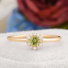 Description : Round Shaped Green Peridot Engagement 14K Solid Gold Ring, Certificated Genuine Peridot Diamond Wedding Ring, Peridot Birthstone Rings Diamond : 0.07 CT. F / SI (6 piece) Natural Green Peridot : 0.16 CT. (1 piece) Gram 1.33 (It may differ depending on the ring size) Product Code: MR0011859 This product belongs to Tilya Jewelery private collection . You can browse our store for other special collection products. All of our products are stamped and made of solid gold . All of our pro Peridot And Diamond Rings, Green Sapphire Ring In 14k Gold For Wedding, Wedding Jewelry With Peridot In Halo Setting, Wedding Cluster Ring In Green With Round Cut, Green Birthstone Ring Fine Jewelry For Wedding, Green Cluster Ring With Halo, Gold Peridot Diamond Ring For May Birthstone, Green Sapphire Ring With Round Cut For Wedding, Green Birthstone Ring With Center Stone For Wedding