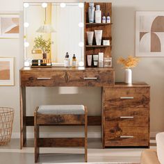 a dressing table with a mirror, stool and bottles on it in a living room