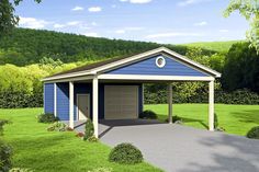 a blue and white garage sitting on top of a lush green field