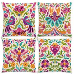 four decorative pillows with colorful designs on the front and back, each decorated in different colors