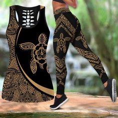 a woman in black and gold patterned leggings is standing on a wooden platform