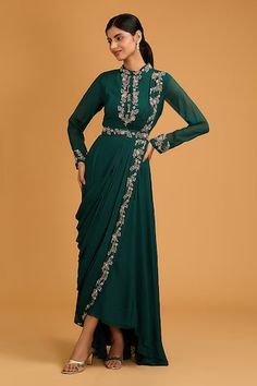 Bottle green draped gown with floral hand embroidery and pleating detail. Paired with an embroidered belt. - Aza Fashions Fitted Anarkali Draped Dress, Fitted Draped Anarkali Dress, Fitted Anarkali Dress With Draped Style, Festive Green Draped Dresses, Anarkali Draped Reception Dress, Anarkali Reception Dress With Draped Style, Reception Anarkali Draped Dress, Formal Traditional Drape Pre-draped Gown, Formal Pre-draped Traditional Gown