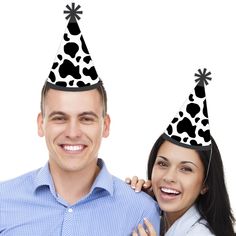 a man and woman wearing party hats on their heads