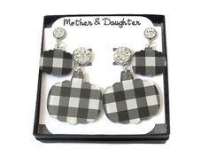 Mommy and me pumpkin white and black buffalo plaid acrylic stud earrings. Both set of earrings are for pierced ears and they are both made with hypoallergenic stainless steel studs. They are light weight and great for sensitive ears. They are handmade by me, and they are cut from acrylic sheets. The earrings are made with black and white buffalo plaid printed acrylic. Please choose if you want the text on the jewelry box card to read Mommy & Me or Mother & Daughter. Please keep small earrings aw Black White Halloween, White Buffalo, Handcrafted Artisan Jewelry, Affordable Gifts, Halloween Jewelry, Jewelry Stand, Small Earrings, Buffalo Plaid, Mommy And Me