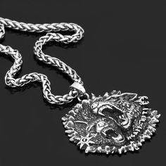 This Viking Necklace is made with stainless steel that will never wear or tarnish. Depicting the two wolves that accompanied Odin, this amulet represents loyalty and trust. According to Norse Mythology, these two wolves were called Geri and Freki. Made of 100% Stainless Steel Length: 60 CM / 24 Inches Choose between with or without the pendant Gothic Engraved Stainless Steel Jewelry, Gothic Stainless Steel Engraved Jewelry, Viking Style Wolf Design Jewelry Gift, Silver Wolf Design Symbolic Jewelry, Silver Symbolic Wolf Design Jewelry, Symbolic Silver Wolf Design Jewelry, Silver Wolf Pendant Necklace, Silver Wolf Design Round Pendant Necklace, Viking Style Silver Stainless Steel Jewelry