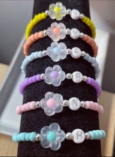 several bracelets are stacked on top of each other