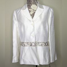 Le Suit White/Ivory Blazer Embellished Beaded Embroidery Trim Making A Belt Like Look Size 16 Woman's New With Tag Some Wrinkles From Storage White Silk Blazer For Wedding, Elegant White Embellished Blazer, White Silk Wedding Blazer, Spring Wedding Embellished Blazer, Elegant White Silk Outerwear, Embellished White Blazer, White Embellished Long-sleeved Blazer, Formal White Embroidered Outerwear, Elegant White Embroidered Outerwear