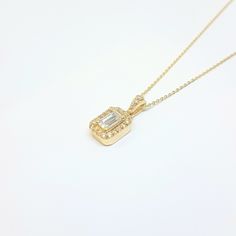 - Baguette Pendant Necklace with Halo was made with high quality 14K real solid gold . - We recommend you to review our other bracelets, earrings, rings and necklaces. We have listed many kinds of beautiful and trendy gold and silver products. You won't regret! https://www.etsy.com/shop/LatikaJewelryShop - Baguette Pendant Necklace with Halo for women is with decorated with white baguette and cubic zirconia stones. - This cute, charm, dainty, delicate, elegant women jewelry Baguette Pendant Neck Yellow Gold Diamond Necklace With Baguette Diamonds For Gift, Gold Cubic Zirconia Necklace With Baguette Cut, Minimalist Gold Baguette Cut Necklace, Gold Diamond Necklace Baguette Cut As Gift, Gold Baguette Cut Diamond Necklace Gift, Yellow Gold Baguette Cut Necklace For Gift, Gold Baguette Diamond Necklaces For Gift, Minimalist Gold Diamond Necklace With Baguette Cut, Gold Necklaces With Baguette Diamonds As Gift