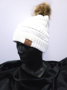 Satin-lined winter hat with tan pom, with signature red satin lining. Pom is not removable. Available in both white and black. Protect your curls this winter! White Winter Beanie One Size, White Winter Beanie Cap, White Fall Beanie One Size Fits Most, White Beanie Cap For Winter, Casual White Crochet Hat For Winter, White Fall Beanie One Size, White Beanie For Fall, One Size Fits Most, White Beanie One Size Fits Most For Fall, White Beanie For Fall, One Size