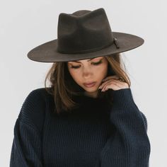 A teardrop crown with a dramatic pinched face + wide flat brim makes the Emery a perfect signature hat. Paired with a tonal grosgrain ribbon band, this hat is ready to impress + complete any look. 100% Australian Wool Dimensions - Crown: 11 cm + Brim: 9 cm. Adjustable inner sweat band for added custom fit. Style fits true to size. See size guid in photos Available in size xs 55cm s/m 57 cm m/l 59 cm Hat Care Gently brush off any dirt or debris with a soft-bristle brush. Avoid getting your hat we Short Brim Hat, Wide Brim Felt Hat, Gigi Pip, Mad Hat, Pencil Roll, Minimal Wardrobe, Floppy Hats, Wide Brim Fedora, Hat Ideas