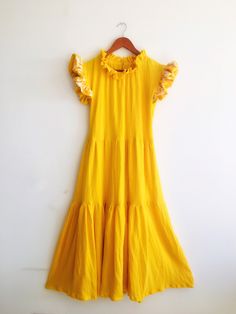 "Otomi Hand embroidery \"MERIDA\" Boho Chic Dress | Yellow ruffles | Resort style 🌻Dress Name: \"MERIDA\" Resort Dress. For introduction, FREE belt is included. With or without pompoms. Just add a note 📝 at checkout stating \"I want my free belt\" 😎 IMPORTANT: This is a Made-To-Order Ships approximately within One or two weeks. Please convo me if you need it before that. All sizes available, please check the chart to select the best for you 🤩 (Also available in Black, Orange, Purple, Multico Cotton Ruffle Dress For Brunch, Yellow Maxi Dress With Ruffles And Short Sleeves, Yellow Short Sleeve Maxi Dress With Ruffles, Resort Dress, San Ysidro, Dress Name, Boho Chic Dress, Resort Dresses, Dress Yellow