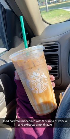 a person holding a starbucks drink in their hand with the caption, cold caramel macchiaia with 8 pumps of vanilla and extra caramel drizle