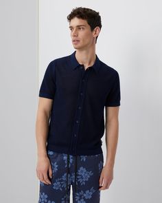 Made from a tactile cotton fabric, woven to resemble crochet, our Cotton Textured Camp Shirt has an especially soft handfeel, making it extra-pleasant against the skin. The silhouette is tailored with a camp collar and a row of tonal buttons to match. The Crochet Knit Button Up Shirt is styled with the Charles 7" Swim Trunk. Summer Button-up Tops In Textured Knit, Relaxed Fit Knit Collared Shirt, Summer Collared Knit Shirt, Summer Knit Collared Shirt, Summer Knit Polo Shirt With Collared Neckline, Textured Knit Cotton Polo Shirt For Summer, Summer Cotton Textured Knit Polo Shirt, Summer Textured Knit Cotton Polo Shirt, Knit Button Up Shirt