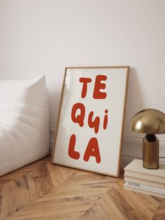 there is a poster that says te quiai la on it next to a lamp