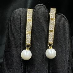 Add a touch of timeless elegance to your jewellery collection with this stunning white pearls earrings. Materials: 8mm shell pearls, gold or platinum plated brass earrings with inlaid zircon. Shell pearls are made from crushed shells. Oyster shells are cut and transformed into powder and then reformed into perfect pearl shape with an infinite shine.  They are very popular as a natural alternative to expensive pearls.  Matching choker here: https://perlettejewellery.etsy.com/listing/1748630709 Ma White Pearl Bridal Earrings With Diamond Accents, Luxury Pearl Earrings With Cubic Zirconia For Evening, Luxury Cubic Zirconia Pearl Earrings For Formal Occasions, Elegant Diamond White Pearl Bridal Earrings, Gold Diamond Dangle Pearl Earrings, Pearl White Cubic Zirconia Pearl Earrings For Evening, Evening Diamond Pearl Drop Earrings, Gold Drop Pearl Earrings With Diamond Accents, Luxury Pearl Drop Cubic Zirconia Jewelry