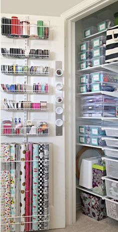 the closet is filled with craft supplies and wrapping paper, scissors, and other items