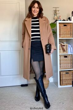 Casual trench coat outfit with skirt and tights and boots for winter street style. Love this camel coat for cold winter outfit ideas. Women's winter outfit ideas are made easy with this laid back women's style. Women's Winter Outfit, Cold Winter Outfit, Outfit With Skirt, Skirt And Tights, Long Camel Coat, Casual Trench Coat, Khaki Coat