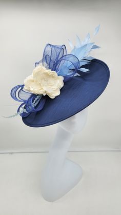 Beautiful large blue fascinator adorn with feathers and flowers. Style to go with a variety of outfits: bridesmaids, cocktail party, Kentucky Derby, Rehearsal dinner, Easter and church outfits. Ones with hair clip and headband. Are you trying to match an outfit? Send a picture and I will help you find a best hat to match your outfit. - Rare find - Ready to ship - Lightweight - Free Shipping - Fast shipping - Customize by adding different color flowers and or feathers Check my store for for style Blue Mini Hats With Handmade Flowers For Royal Ascot, Elegant Feather Trim Top Hat For Party, Elegant Feather Trim Fascinator For Spring, Elegant Feather Trim Fascinator Hat, Elegant Party Top Hat With Feather Trim, Elegant Feather Trim Fascinator, Blue Feather Trim Fascinator For Kentucky Derby, Blue Fascinator With Handmade Flowers For Kentucky Derby, Wedding Mini Hat With Feather Trim For Kentucky Derby