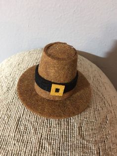 a brown hat sitting on top of a table