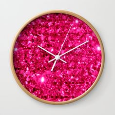 a clock with pink glitter on the face