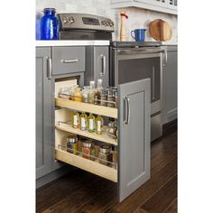 an open drawer in the middle of a kitchen