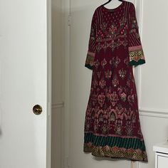 Worn Only Once And Is In Excellent Condition This Is A Stunning Embroidered Long Maxi Dress With Front And Back Both Embroidered The Pants Are Brand New They Have Not Been Worn The Dupatta Is A Stunning Net Piece With Two Different Style Borders Indian Pakistani Multicolor Embroidered Floor-length Dress, Long Embroidered Festive Dress, Long Floral Embroidered Festive Dress, Festive Multicolor Embroidered Long Sleeve Dress, Festive Long Sleeve Dress With Multicolor Embroidery, Festive Multicolor Embroidered Embellished Dress, Festive Multicolor Embellished Embroidered Dress, Long Sleeve Embroidered Dress With Dabka Work, Red Embroidered Long Sleeve Dress