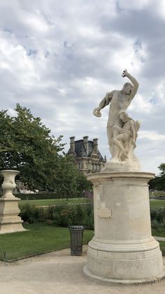 a statue in the middle of a park