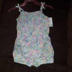 New With Tag Size 18 Months Carter's Floral Bodysuit. Casual Pink Onesie For The Beach, Blue Fitted Bubble Romper For Spring, Fitted Blue Bubble Romper For Spring, Spring Fitted Blue Bubble Romper, Blue Bubble Romper For Summer, Blue Summer Bubble Romper For Playtime, Casual Blue Bubble Romper For Spring, Multicolor Jumpsuits And Rompers For Spring Playtime, Spring Blue Onesie For Playwear