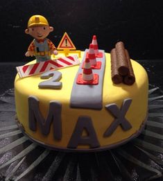 a birthday cake for a construction worker on top of a table