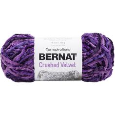 yarn ball in purple and white with the words bernat crushed velvet