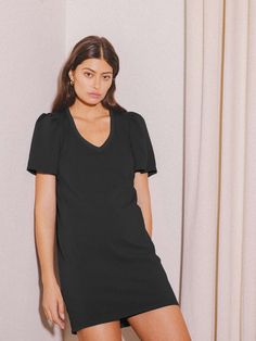 It doesn't get easier than this one-and-done mini t-shirt dress. And yes, the flattering flutter sleeve really does make your waist look smaller - don't worry, we won't tell. (This one comes in Jet Black.) | Mallory Dress in Jet Black | Ethical Essentials Chic Mini Dress With Relaxed Fit, Chic Relaxed Fit Mini Dress, Chic Relaxed-fit Mini Dress, Relaxed Fit Knee-length Mini Dress For Work, Fitted Black Mini Dress With Flutter Sleeves, Chic Knee-length Mini Dress With Relaxed Fit, Chic Knee-length Relaxed Fit Mini Dress, Chic Relaxed Knee-length Mini Dress, Chic Relaxed Fit Knee-length Mini Dress