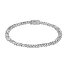 This eye-catching Cuban link style bracelet is accented with pave round brilliant cut diamonds. Classic Chain Bracelet With Cubic Zirconia, Silver Diamond Bracelet With Solid Link Construction, White Gold Cubic Zirconia Link Chain Bracelet, White Gold Cubic Zirconia Chain Link Bracelet, Elegant Cuban Link Tennis Bracelet, Classic White Gold Cuban Link Bracelet With Diamond Accents, Elegant Diamond Cuban Link Tennis Bracelet, Elegant Diamond Bracelet With Cuban Link, Elegant Cuban Link Diamond Cut Bracelets